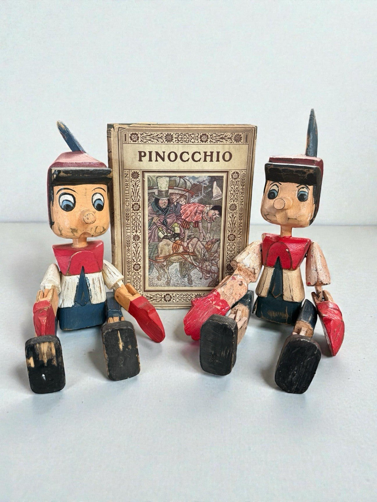 Pair Of Vintage Wooden Pinocchio Figures Hand Carved Including Book