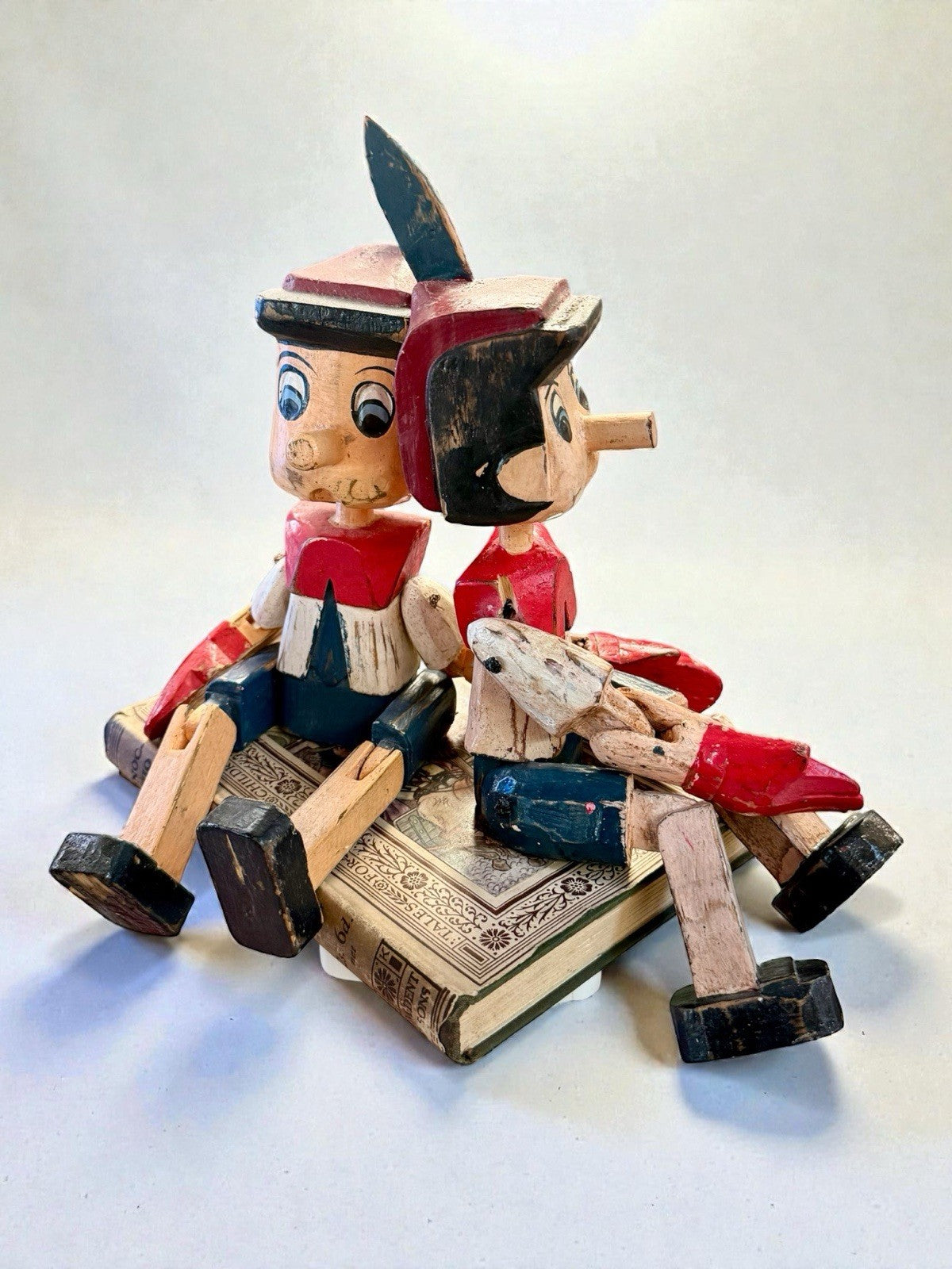 Pair Of Vintage Wooden Pinocchio Figures Hand Carved Including Book